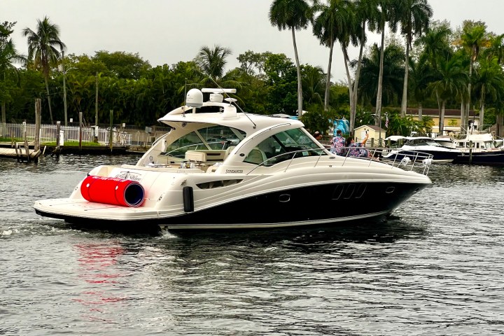 Rental Boat in Miami cruising on the Miami River during a charter.