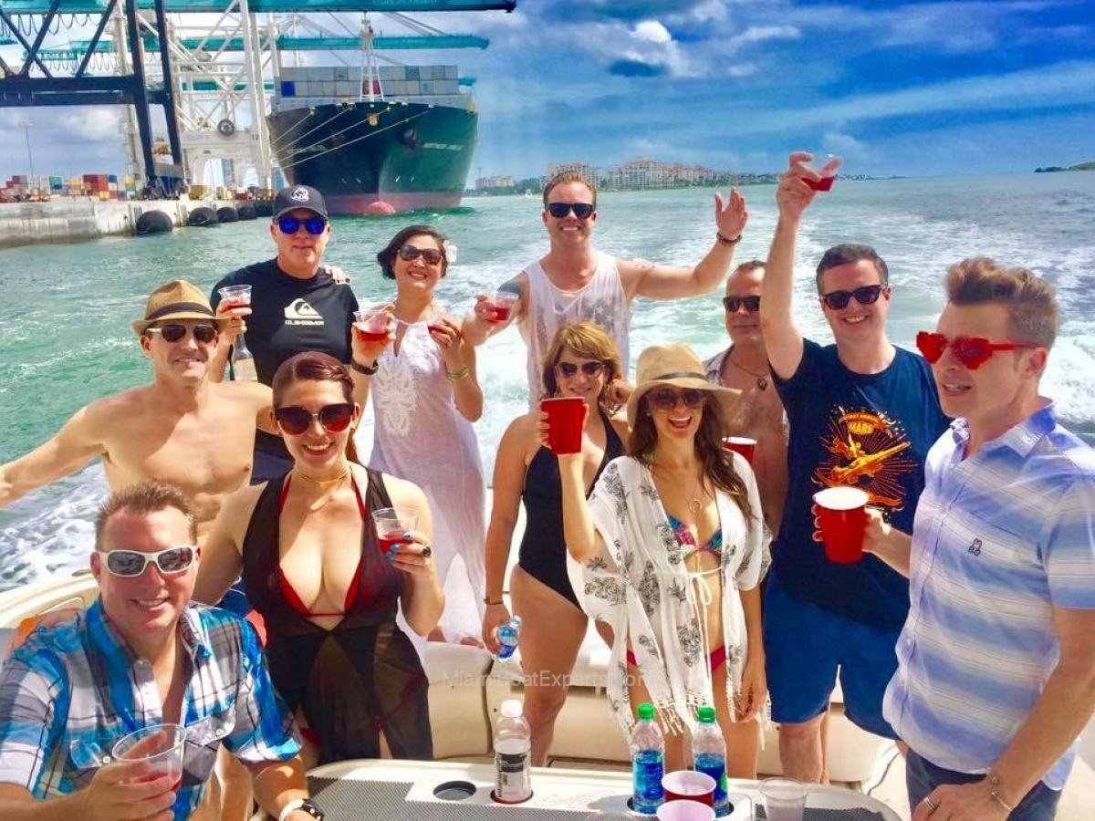 Guests on the main deck of our boat rental in Miami Beach.