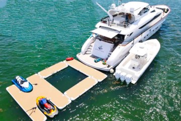 Miami yacht rental at anchor with water toys deployed.