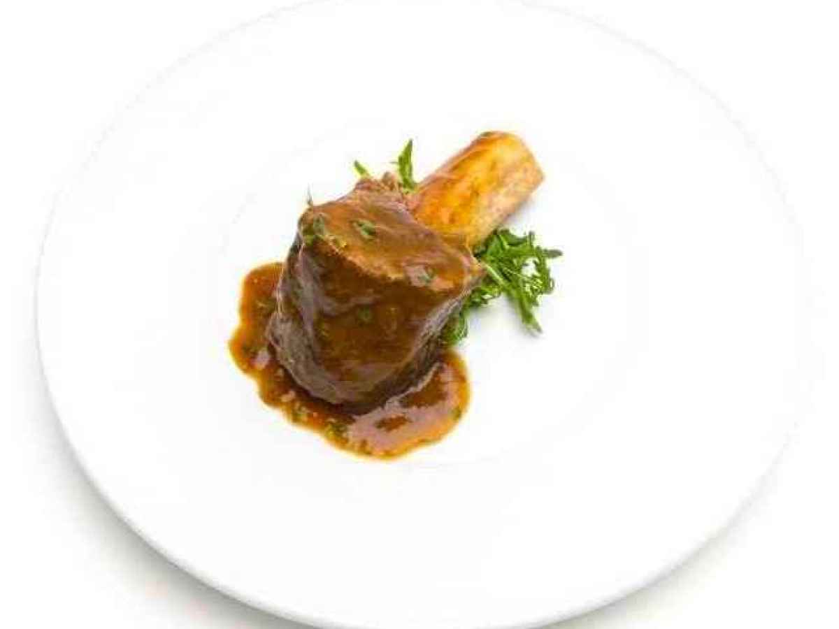 a plate of food Made with beef short rib, red wine, beef stock, herbs, and balsamic vinegar. Gluten free