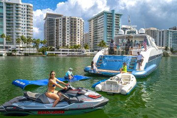 Guests enjoying the water toys of this yacht rental in North Bay Village.
